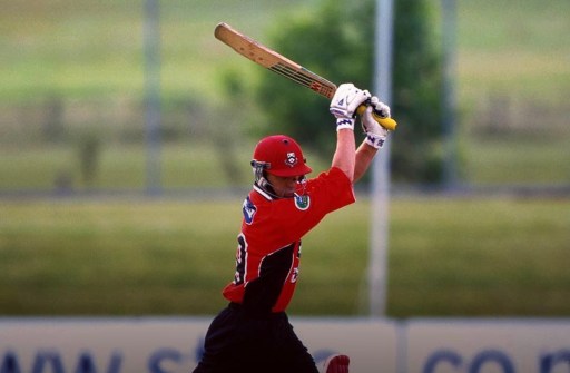 A person swinging a bat
Description automatically generated